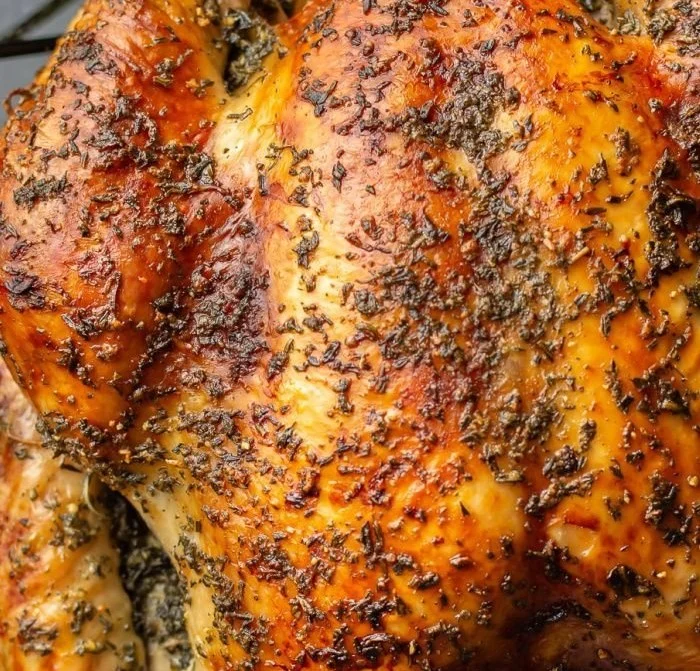Delicious roast turkey served on a festive table with side dishes