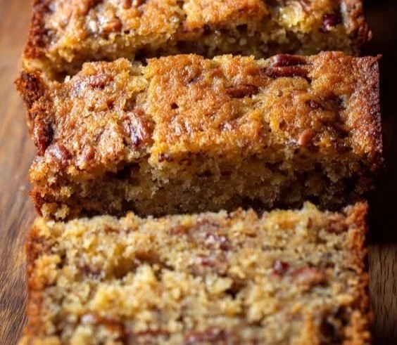Loaf of Sweet Alabama Pecan Bread with nuts and a golden crust
