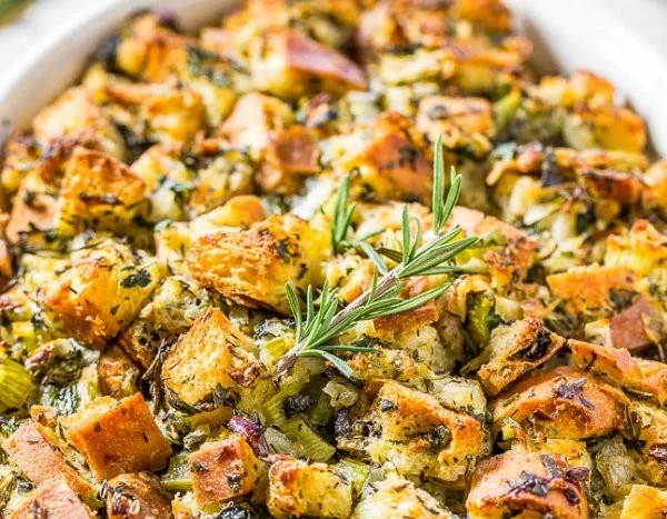 Traditional Thanksgiving stuffing served with turkey on a festive table.